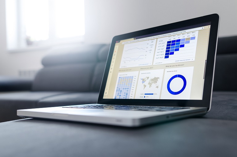 Laptop with data on table